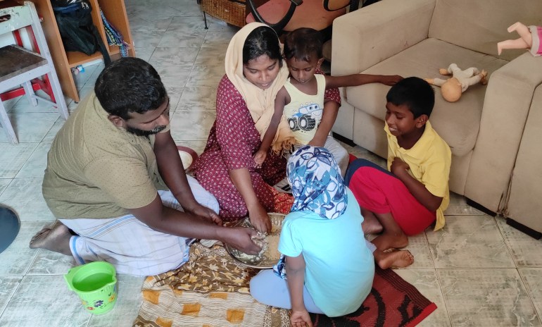 A family in Sri Lanka eats lunch at home