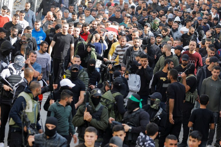 Mourners attend the funeral of Palestinian high-schooler Mahmoud al-Sadi