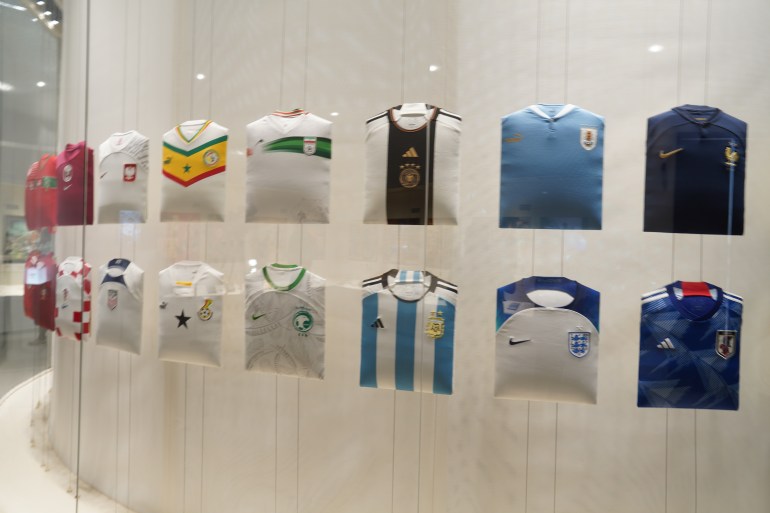 Football jerseys are displayed at the FIFA Museum presented by Hyundai in Doha, Qatar.