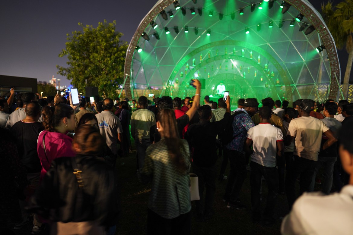 Fans celebrate at a concert in Doha prior to the start of the FIFA World Cup