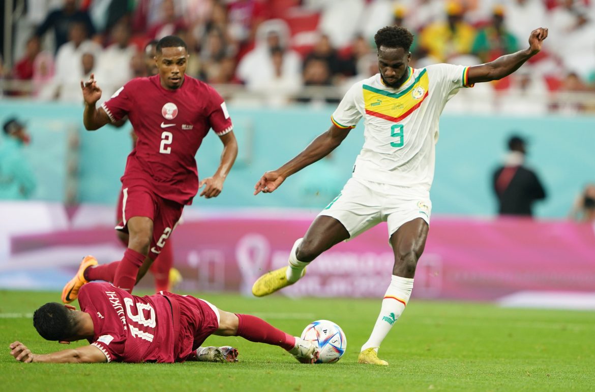 Senegal's Boulaye Dia shoots and scores a goal