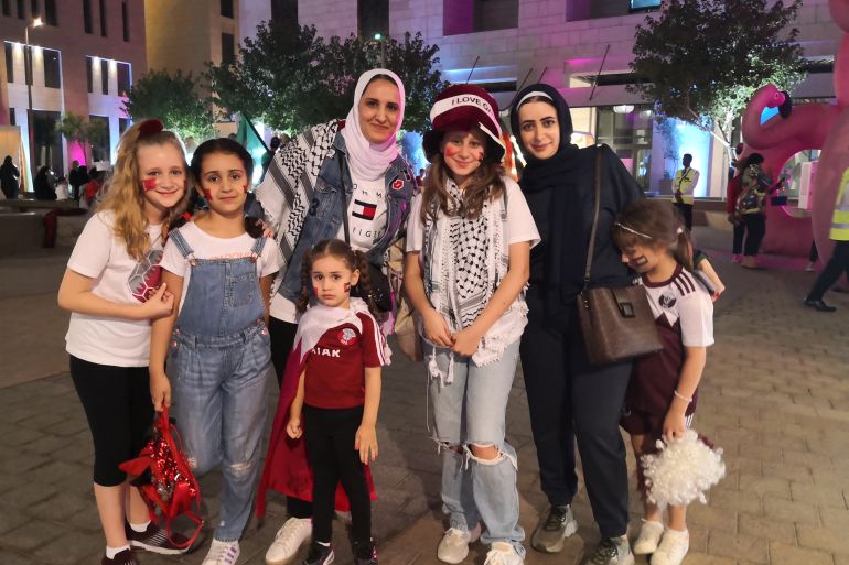 Sonia Nemmas, a Jordanian mother, with her three daughters and friends out in Doha supporting Qatar on Friday, November 18, 2022. (Hafsa Adil/Al Jazeera)