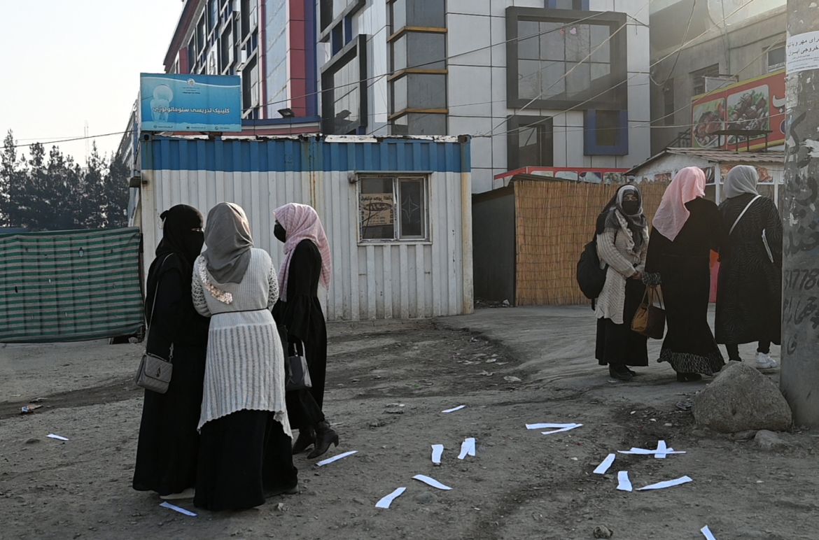 Afghan female university students walk