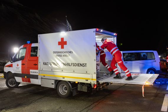Rescuers work at the ski resort of Lech Zurs