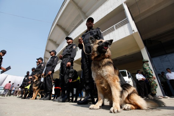 RAB members stand guard with police dogs.