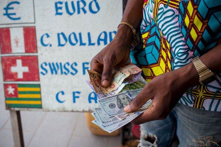 A man holds money in Ghana