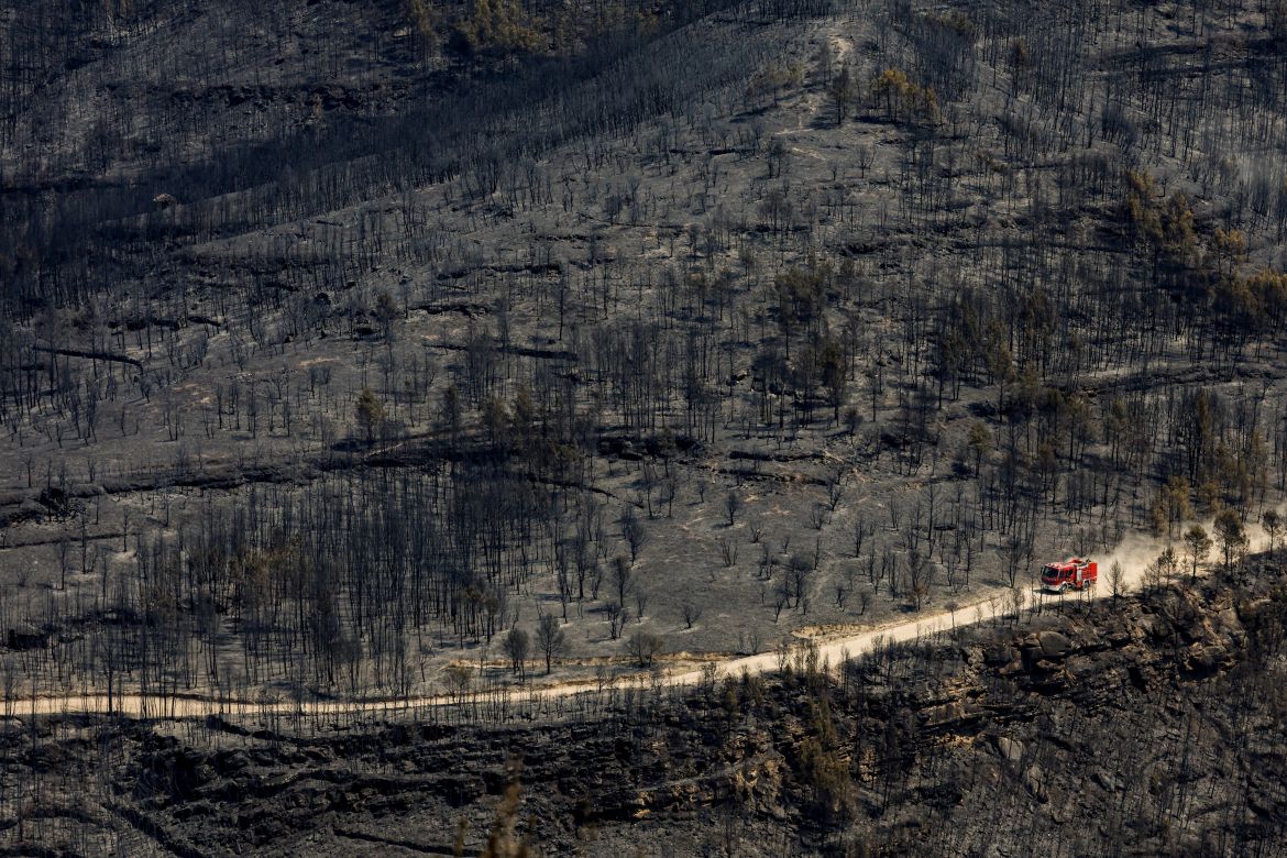 A fire engine drives during a wildfire in El Pont de Vilomara