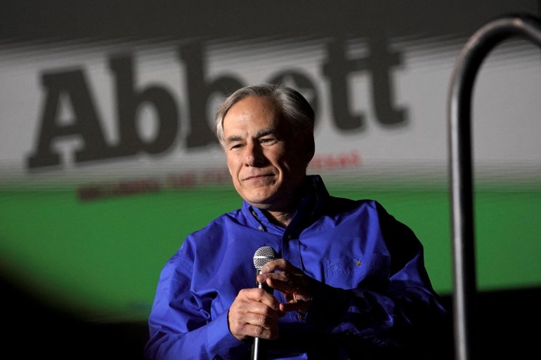 Governor Greg Abbott campaigned in front of a banner with his name on it