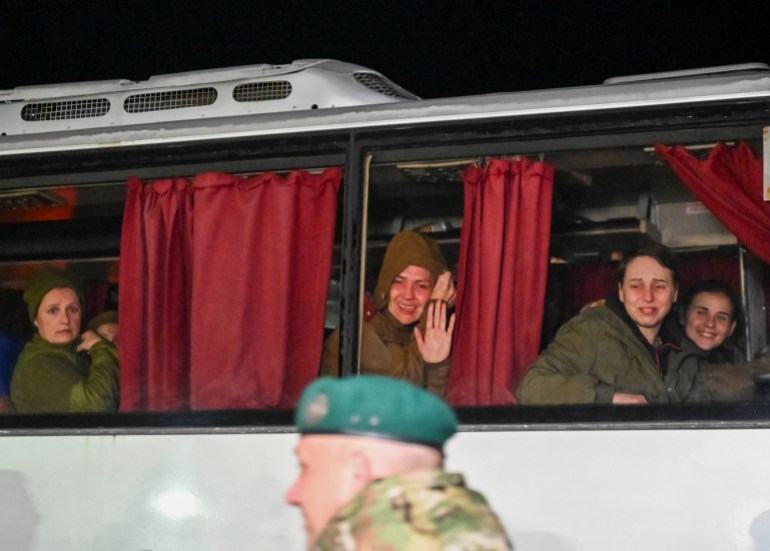 Ukrainian prisoners of war (POWs) look out of a bus window, amid Russia's attack on Ukraine, as they arrive in Zaporizhzhia, Ukraine October 17, 2022.