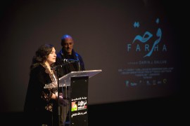 Producer Deema Azar and actor Ashraf Barhom introduce Farha during the ninth edition of the Palestine Cinema Days festival, in Ramallah, in the Israeli-occupied West Bank, on November 7, 2022 [File: Film Lab Palestine/Handout via Reuters]