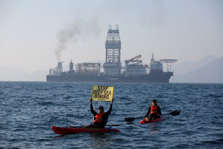 Greenpeace activists from New Zealand and Mexico confront the deep sea mining vessel Hidden Gem, commissioned by Canadian miner The Metals Company, as it returned to port from eight weeks of test mining in the Clarion-Clipperton Zone between Mexico and Hawaii, off the coast of Manzanillo, Mexico November 16, 2022.
