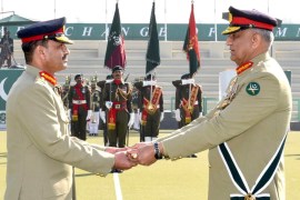 Outgoing army chief General Qamar Javed Bajwa, right, hands over the baton of command to General Asim Munir during a ceremony at the military headquarters in Rawalpindi, Pakistan [File: Inter Services Public Relations (ISPR)/Handout via Reuters]