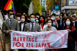 Plaintiffs, lawyers and supporters march as they head to the court which will rule on the constitutionality of same-sex marriage, in Tokyo, Japan