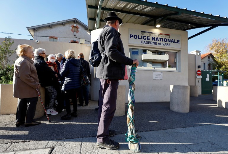 Residents queue to drop off their undeclared firearms at a police station in Nice as part of an unprecedented collection campaign organised by French authorities to reduce the number of illegally-held weapons in France