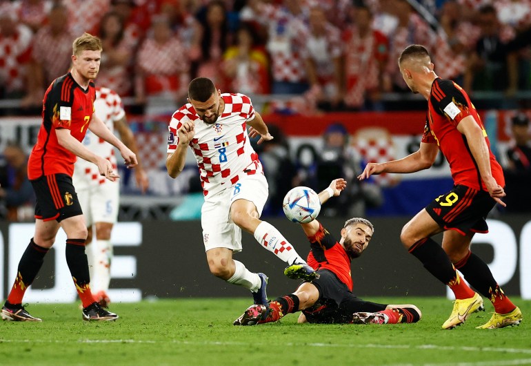 Croatia's Mateo Kovacic in action with Belgium's Yannick Carrasco