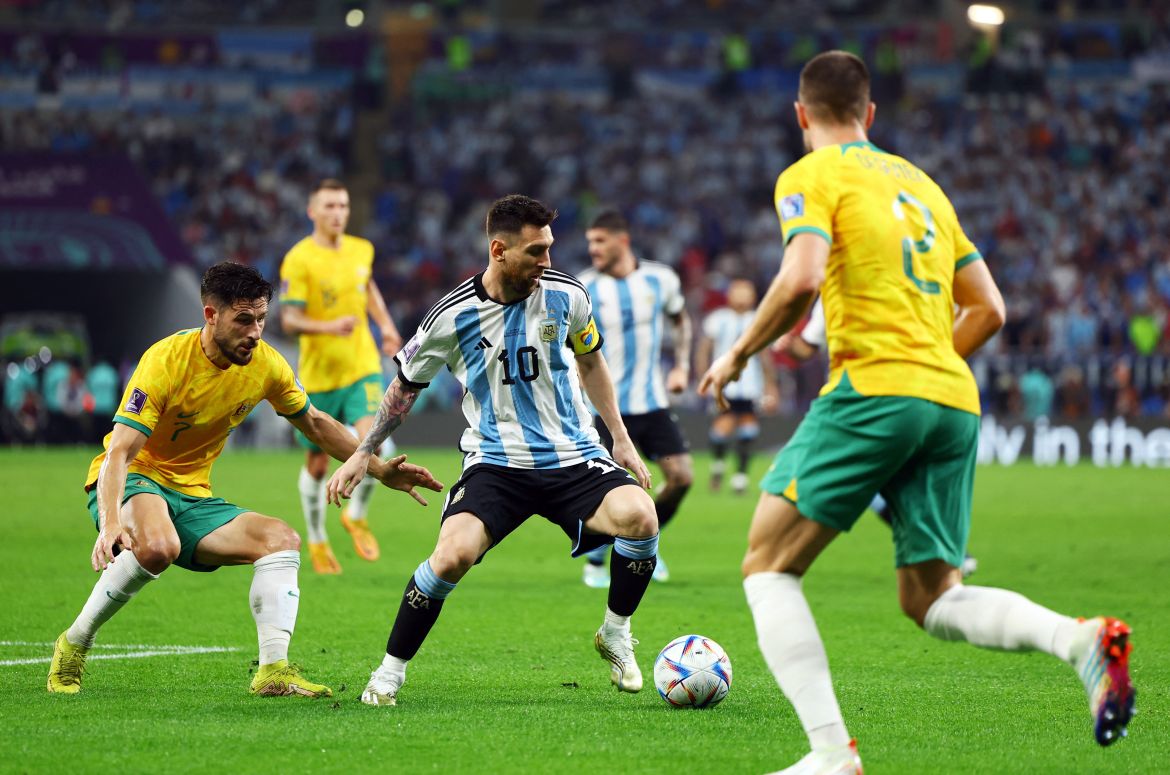 Lionel Messi in action with Australia's Mathew Leckie