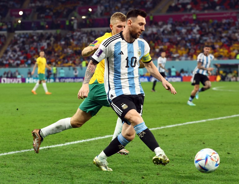 Argentina's Lionel Messi in action with Australia's Riley McGree.