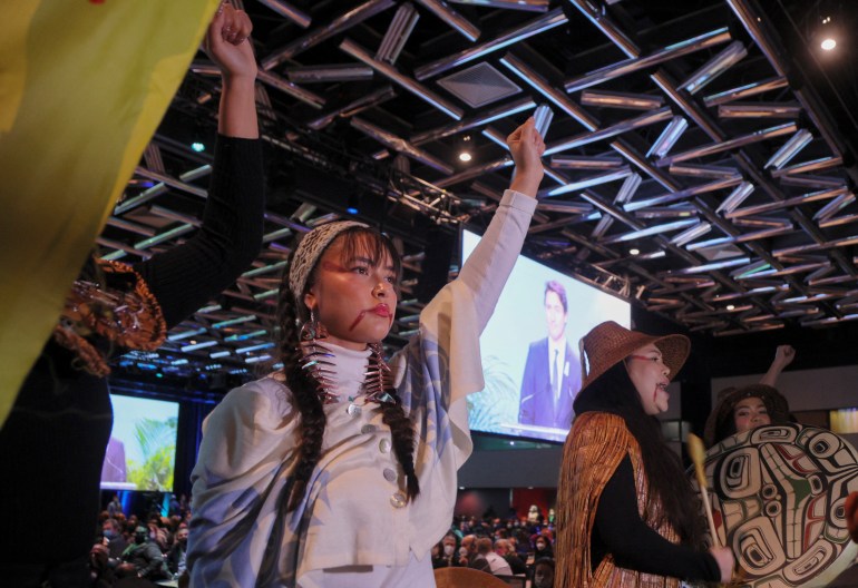 Indigenous activists protest Justin Trudeau during COP15 opening ceremony