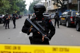Armed officers sealed off the area after the blast at a police station in Bandung [Willy Kurniawan/Reuters]