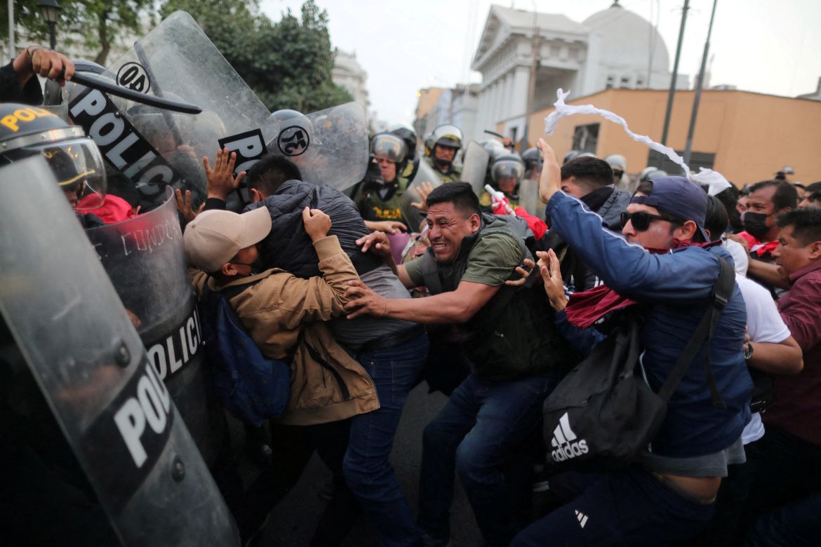 Demonstrators clash with riot police during a protest