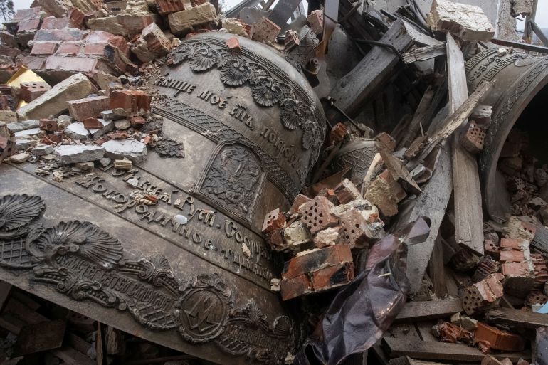 Bells are seen surrounded by debris of a destroyed Orthodox church in Donetsk region,
