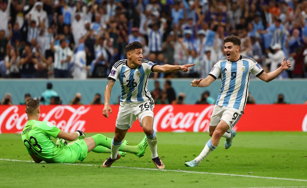 Argentina's Nahuel Molina celebrates scoring their first goa