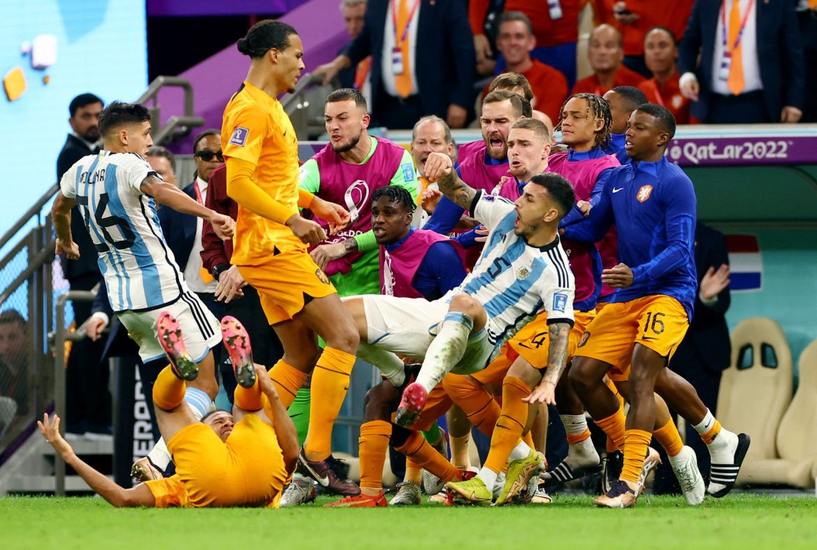 Argentina's Leandro Paredes clashes with Netherlands' Virgil van Dijk