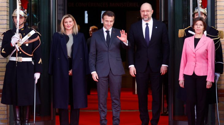 Ukraine's first lady Olena Zelenska, French President Emmanuel Macron, Ukrainian Prime Minister Denys Shmyhal and French Foreign Minister Catherine Colonna pose as they arrive to attend the international conference "Standing With the Ukrainian People" in Paris, France, December 13, 2022. REUTERS/Gonzalo Fuentes