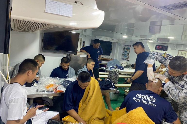 Crew members from the capsized HTMS Sukhothai warship receive medical treatment in the Gulf of Thailand, December 18, 2022. Royal Thai Navy/Handout via REUTERS THIS IMAGE HAS BEEN SUPPLIED BY A THIRD PARTY. MANDATORY CREDIT. NO RESALES. NO ARCHIVES