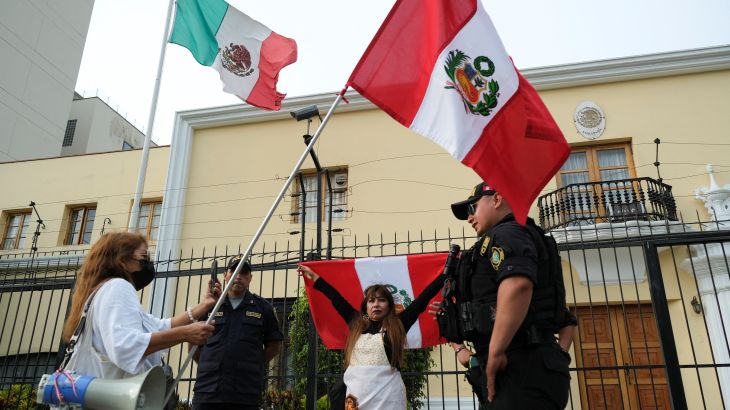 Demonstrators stand outside the Mexican embassy after Mexico's Foreign Minister Marcelo Ebrard said that Mexico has granted asylum to the family of former Peruvian President Pedro Castillo, in Lima, Peru December 20, 2022. REUTERS/Liz Tasa