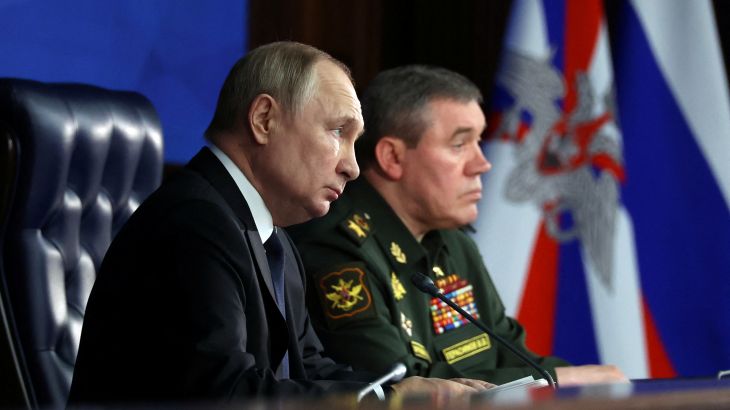 Russian President Vladimir Putin and Chief of the General Staff of Russian Armed Forces Valery Gerasimov attend an annual meeting of the Defence Ministry Board in Moscow