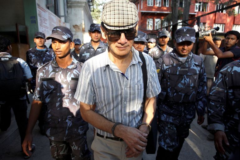 FILE PHOTO: French serial killer Charles Sobhraj leaves Kathmandu district court after his hearing in Kathmandu May 31, 2011.