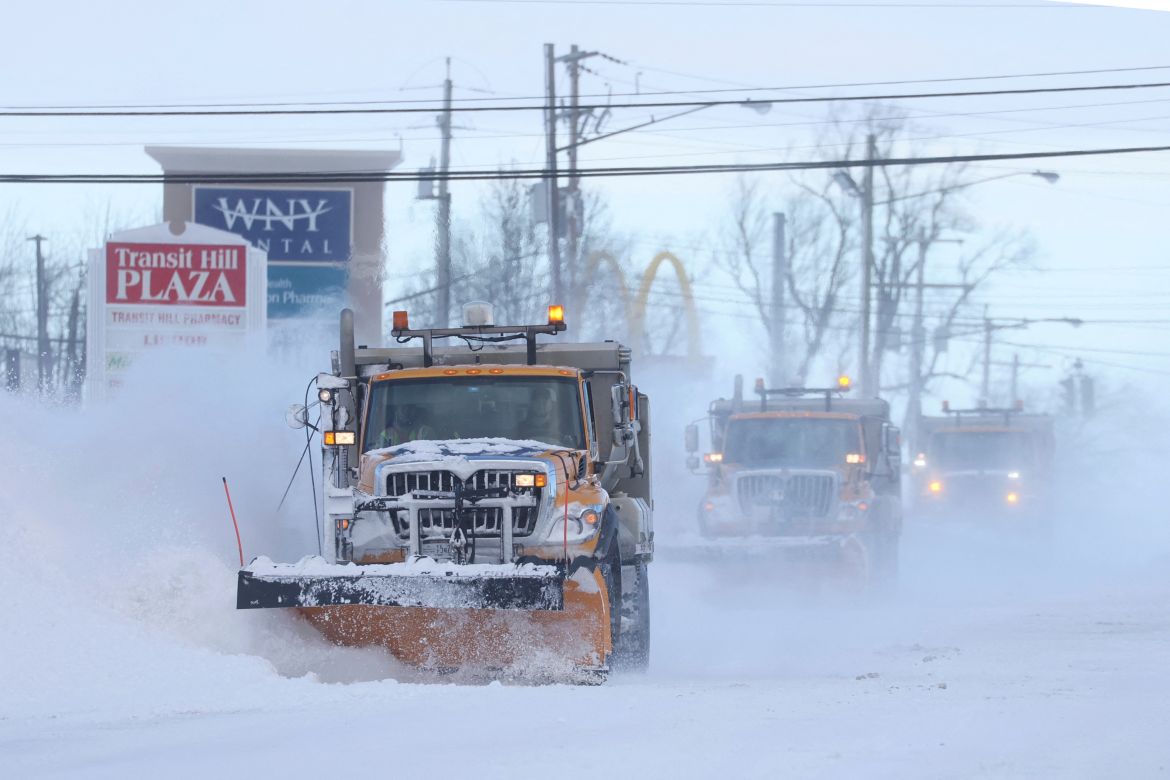Snow plows clear the roads following a winter storm that hit the Buffalo region in the state of New York, the US.