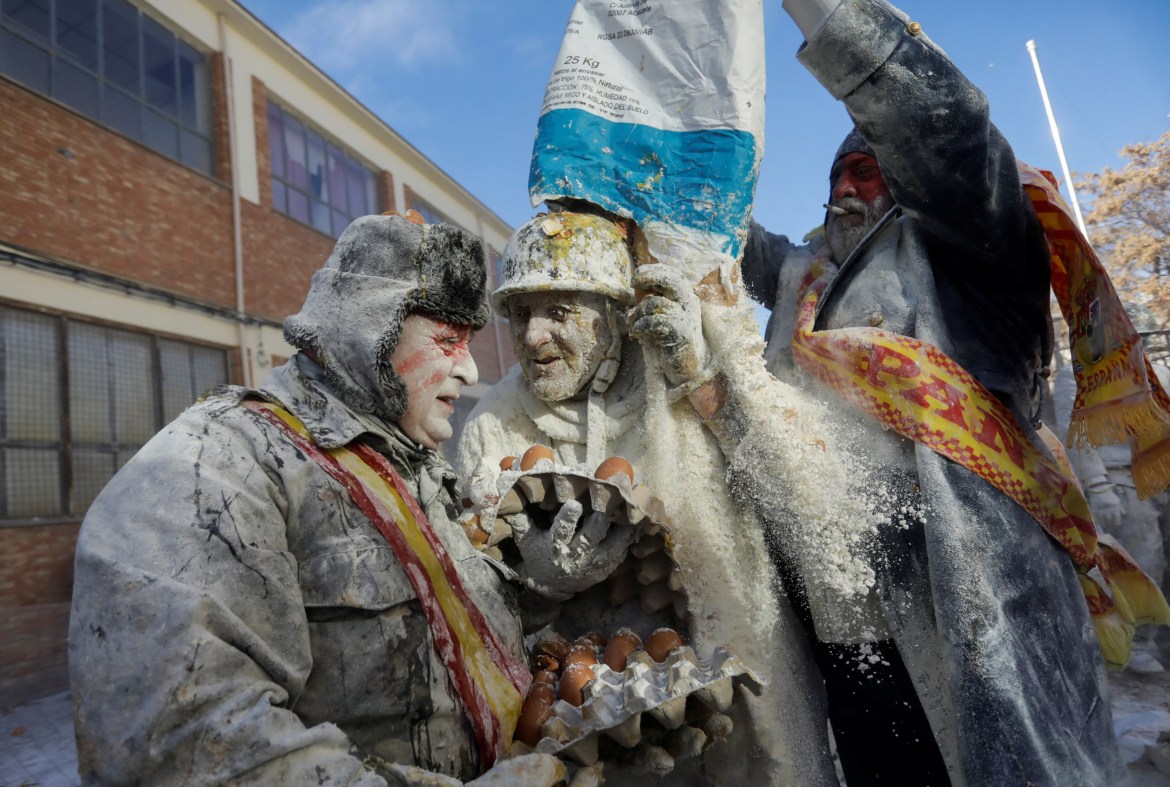 Revellers take part in the traditional "Els Enfarinats"