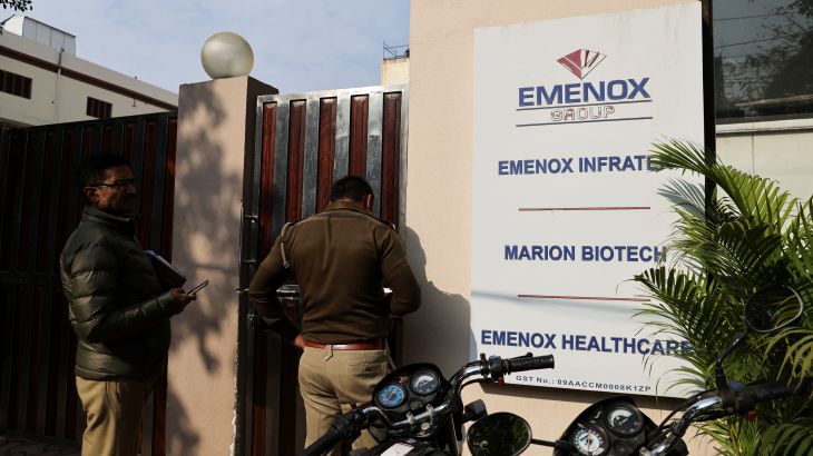 Police at the gate of an office of Marion Biotech, a healthcare and pharmaceutical company, whose cough syrup has been linked to the deaths of children in Uzbekistan, in Noida, India