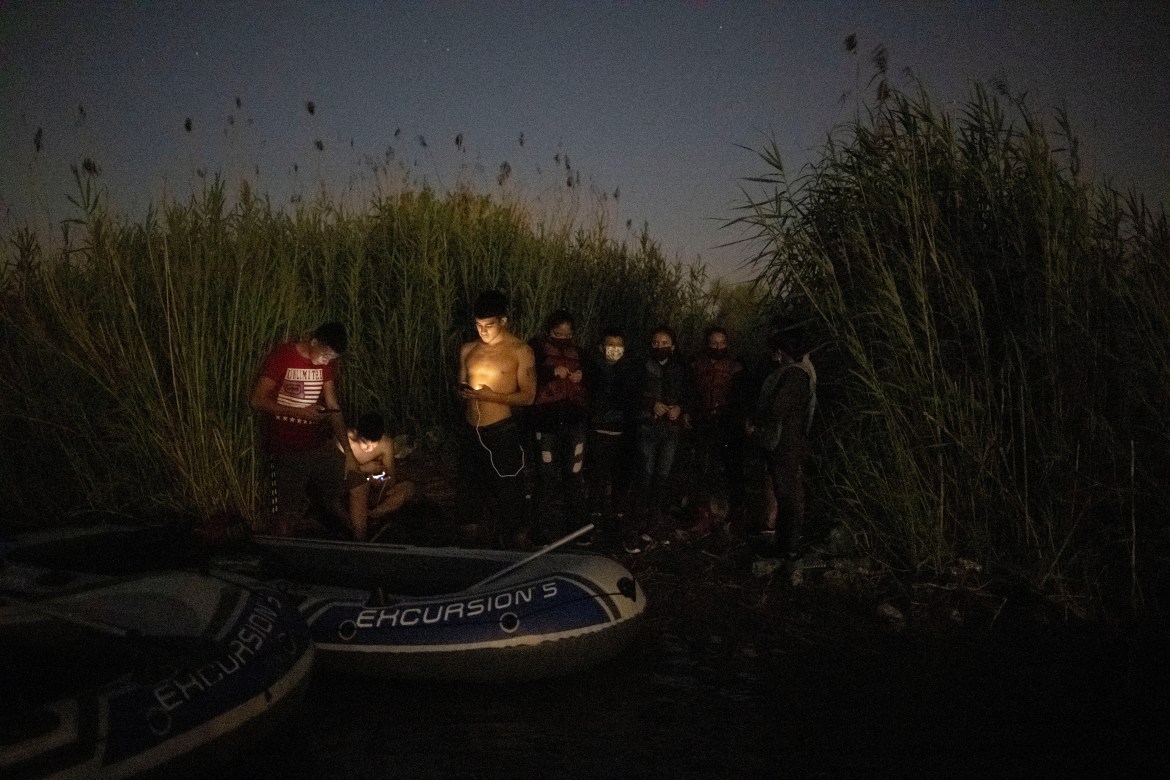 Smugglers are illuminated by their phones