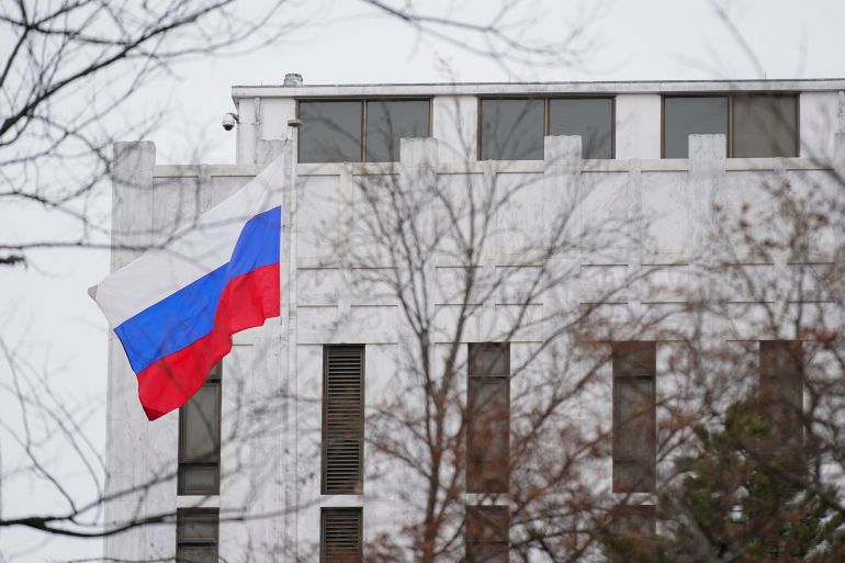 The Russian flag flies outside the Embassy of Russia in Washington