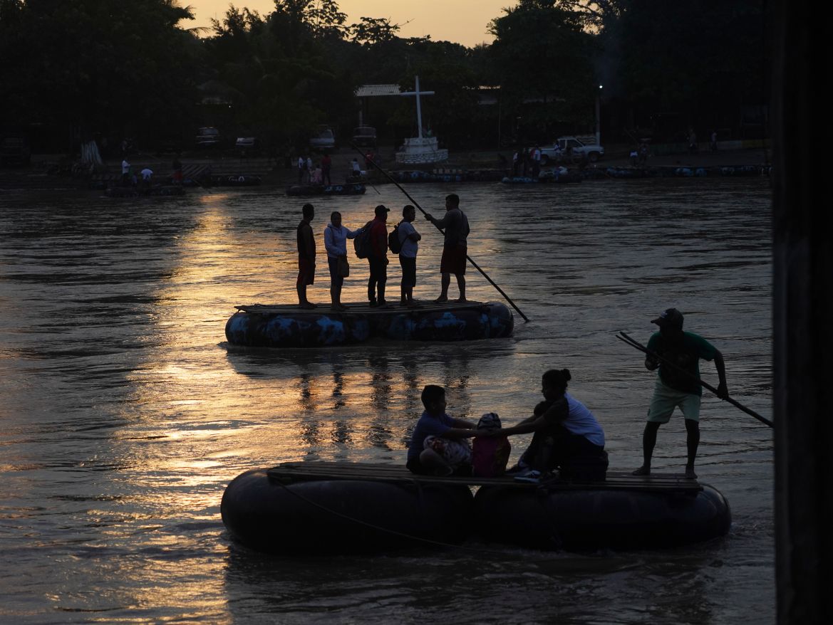 Venezuelan migrants cross the Suchiate River
