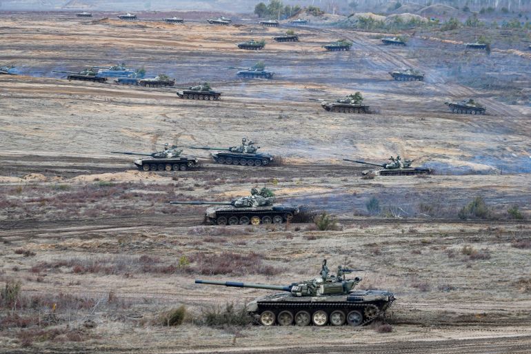 FILE - Tanks participate in the Union Courage-2022 Russia-Belarus military drills at the Obuz-Lesnovsky training ground in Belarus, Saturday, Feb. 19, 2022. (AP Photo/Alexander Zemlianichenko Jr., File)