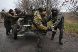 Ukrainian National guard soldiers move from a location