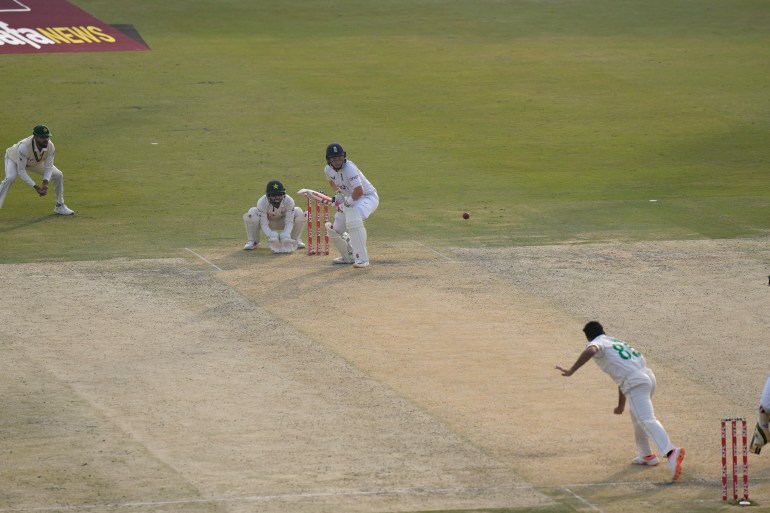 England's Ollie Pope, center, bats during the first day of the first test cricket match between Pakistan and England, in Rawalpindi, Pakistan, Dec. 1, 2022. (AP Photo/Anjum Naveed)