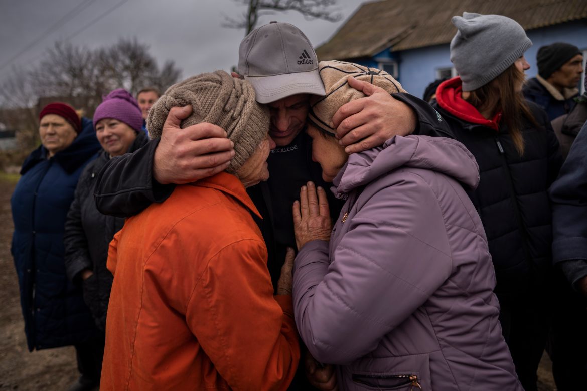In the village of Tsentralne, Ukrainian family members meet for the first time since Russian troops withdrew from the Kherson region, southern Ukraine, Sunday, Nov. 13, 2022. Families were torn apart when Russia invaded in February, as some fled and others hunkered down. (AP Photo/Bernat Armangue)