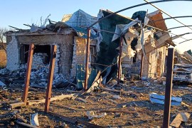 A damaged building and a car are seen after a Russian attack in the village of Novosofiivka, in the Zaporizhia region, Ukraine [Zaporizhia region military administration via AP]
