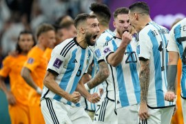 Argentina players celebrate during the penalty shootout in the World Cup quarter-final match between the Netherlands and Argentina [Ebrahim Noroozi/AP]