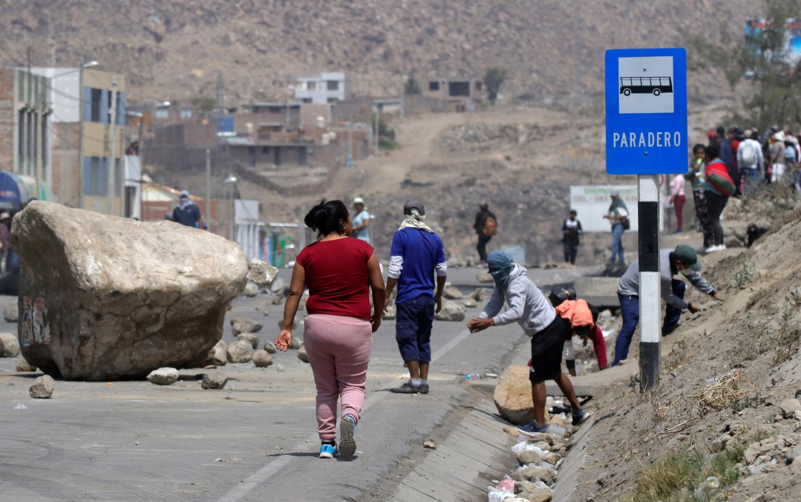 Supporters of ousted Peruvian President Pedro Castillo block a highway