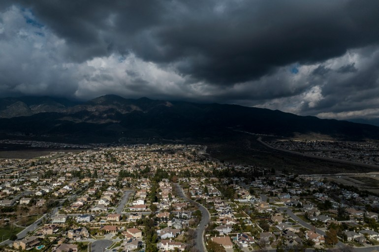 Storm clouds gather in aerial photo of San Bernandino County's populous areas
