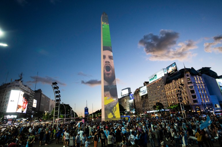 Argentine soccer fans gather at the Obelisk landmark during a rally in support of the national soccer team, a day ahead of the World Cup final against France, in Buenos Aires, Argentina, Saturday, Dec. 17, 2022. (AP Photo/Rodrigo Abd)