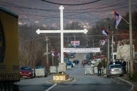 Serb protesters stand at the barricade near the village of Rudare, close to Zvecan, near the northern, Serb-dominated part of ethnically divided town of Mitrovica, Kosovo,