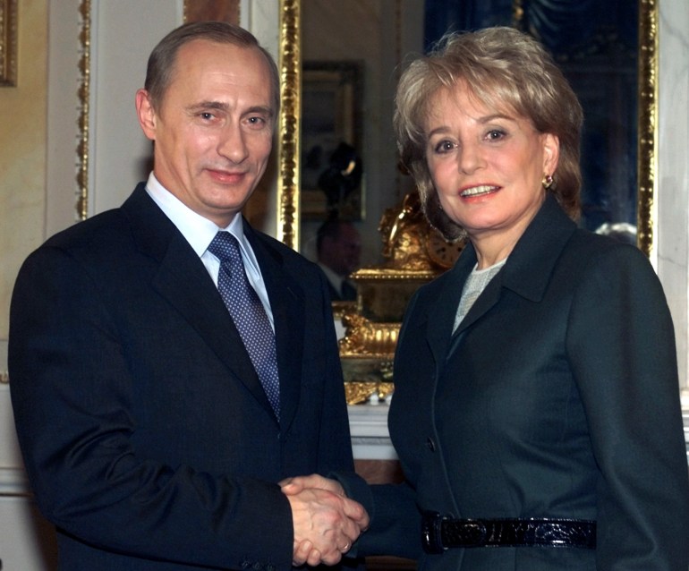 FILE - President Vladimir Putin, left, shakes hands with U.S. ABC television journalist Barbara Walters at the Moscow Kremlin, Monday, Nov. 5, 2001. Barbara Walters, the intrepid interviewer, broadcaster, and broadcaster who became the first woman to become a TV news reporter superstar during a network career notable for its duration and variety, passed away on Friday, December 30, 2022. She was 93. (AP Photo/Mikhail Metzel, File)