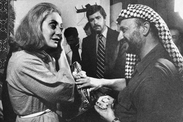 FILE - This September 21, 1977 file photo shows Palestinian leader Yasir Arafat, right, presenting ABC's Barbara Walters with a handmade dress and mother-of-pearl box after interviewing him in Beirut.  Barbara Walters, the intrepid interviewer, host and program host who became the first woman to lead the way to TV news superstardom during a network career notable for its duration and variety, passed away on Friday, December 30, 2022.  She was 93 years old.  (AP Photo/Harry Koundakjian, File)